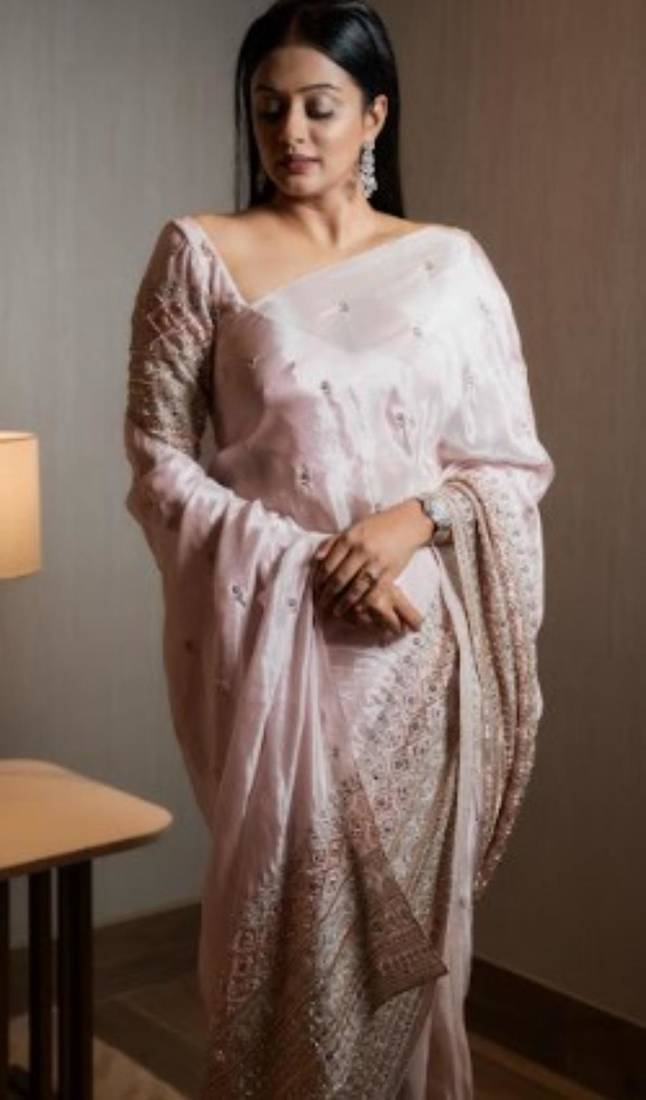 Cream pure tissue silk heavy thread embroidery work on border with zari weaving saree with blouse