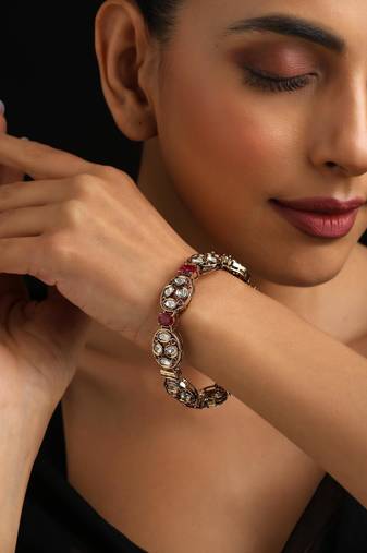 Gold plated red stone kundan bangle