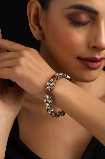 Gold plated red stone kundan bangle