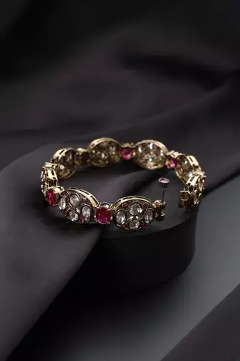 Gold plated red stone kundan bangle