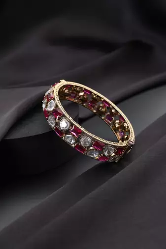 Gold plated red stone kundan bangle