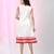 Women's white cotton a-line ethnic dress with red checkered sleeves & ruffle hem