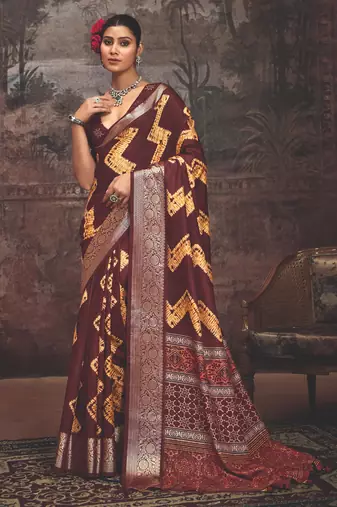 Maroon dolla silk blend self jaquard border saree with unstitched blouse