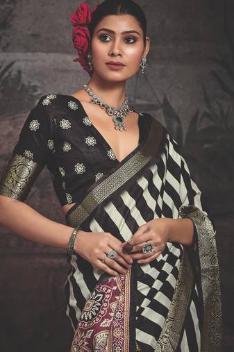 Black dolla silk blend self jaquard border saree with unstitched blouse