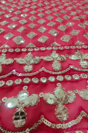 Red georgette lehenga choli with silver sequin embroidered