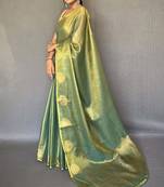 Greeen silk blend saree with unstitched blouse