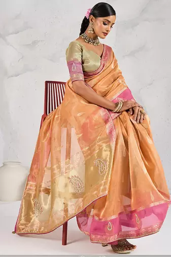 light orange soft tissue linen saree with blouse piece