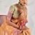 light orange soft tissue linen saree with blouse piece