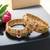 Set of 2 gold plated red & green stone studded bangles