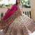 Elegant White Lehenga with Vibrant Multicolor Embroidery and Contrasting Magenta Dupatta