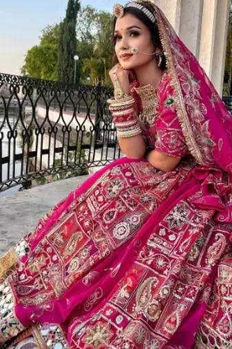 Regal Pink Lehenga with Intricate Embroidery, Mirror Work, and Patchwork Border