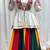 Colorful Traditional Bandhani Lehenga with Embroidered White Peplum Jacket