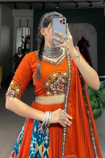 Rich Orange Lehenga with Intricate Ikat and Embroidered Mirror Work