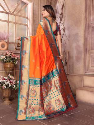 Orange silk blend zari weaving paithani saree with peacock border and pallu 4