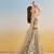 Ivory net lehenga with sequins and thread embroidery work