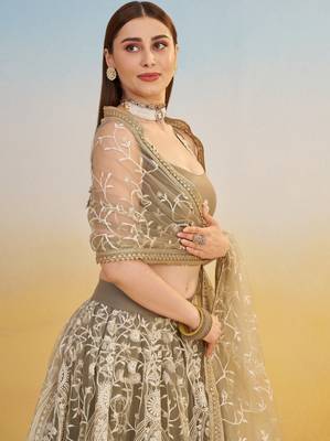 Ivory net lehenga with sequins and thread embroidery work 3