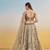 Ivory net lehenga with sequins and thread embroidery work