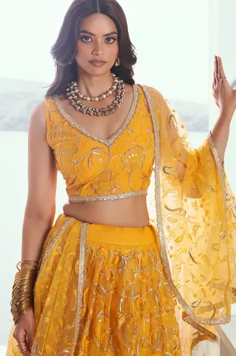 Yellow net lahenga with sequins and thread embroidered Lehenga Choli