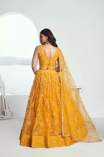 Yellow net lahenga with sequins and thread embroidered Lehenga Choli