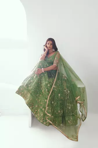 Pista green net lahenga with sequins and thread embroidered Lehenga Choli