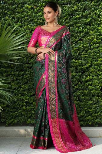 Green patola silk blend saree with zari woven work and fancy tassel pallu