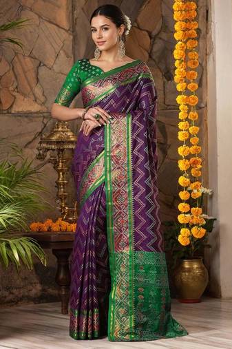 Magenta patola silk blend saree with zari woven work and fancy tassel pallu