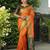 Orange patola silk blend saree with zari woven work and fancy tassel pallu