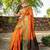 Orange patola silk blend saree with zari woven work and fancy tassel pallu