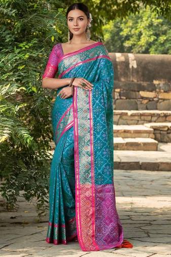 Turquoise patola silk blend saree with zari woven work and fancy tassel pallu