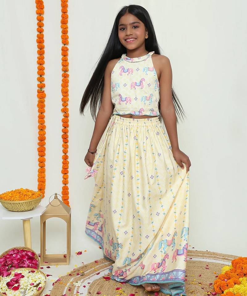 Butter yellow with carasouel print/lehenga with halter neck blouse