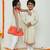 Yellow and orange dual ruffle dress with tie bow detailing /organic cotton