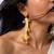 Regal swirl high gold statement earrings