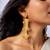Regal swirl high gold statement earrings