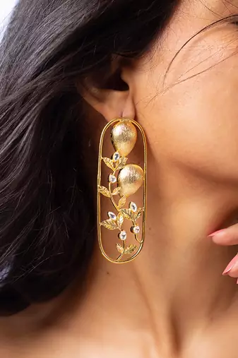 High gold floral frame earrings with stone accents