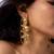 High gold floral frame earrings with stone accents