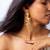 High gold floral frame earrings with stone accents