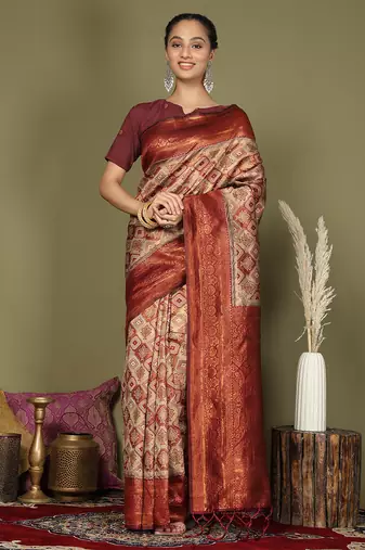 red and cream silk blend saree with rich woven pallu