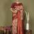 red and cream silk blend saree with rich woven pallu