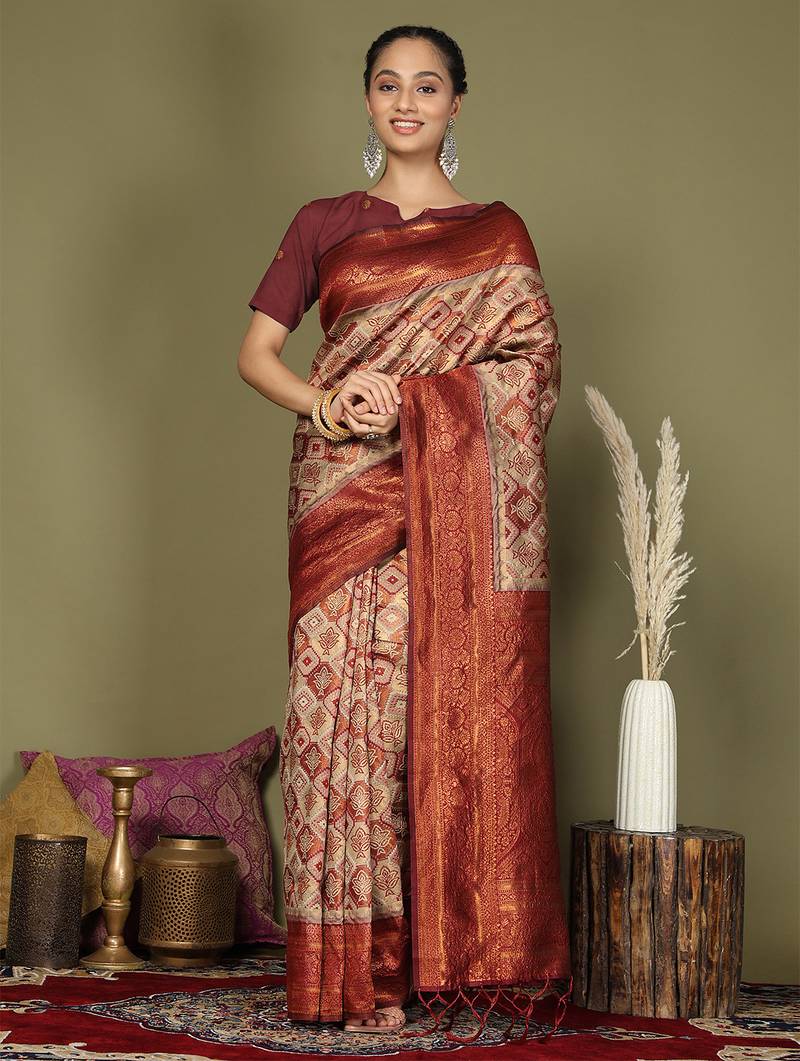 red and cream silk blend saree with rich woven pallu
