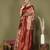 red and cream silk blend saree with rich woven pallu
