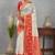 Traditional white and red art silk saree with gold accents