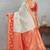 Traditional white and red art silk saree with gold accents