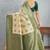 Elegant cream and green banarasi silk saree with zari detailing