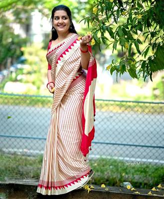 Elegant off-white saree with red stripes and geometric border 3