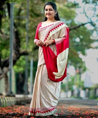 Elegant off-white saree with red stripes and geometric border 4