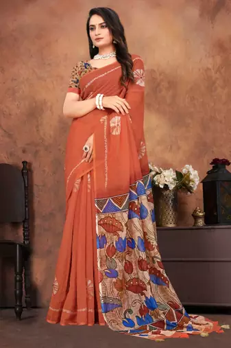 Earthy terracotta saree with artistic floral pallu