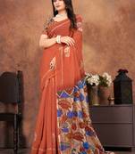 orange saree with artistic floral pallu