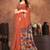 Earthy terracotta saree with artistic floral pallu