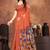 Earthy terracotta saree with artistic floral pallu