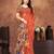 Earthy terracotta saree with artistic floral pallu